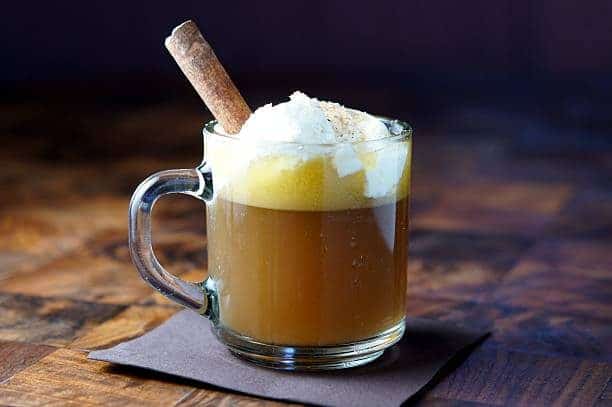 hot-buttered-rum-cocktail-with-whipped-egg-whites-and-a-cinnamon-stick